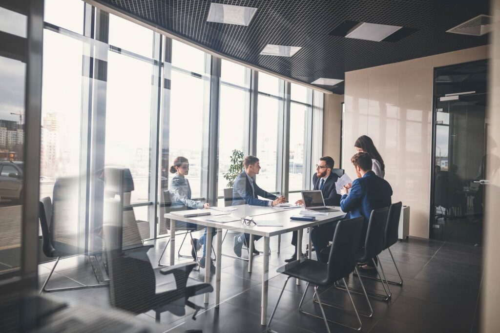 Sharp-dressed team in an office meeting