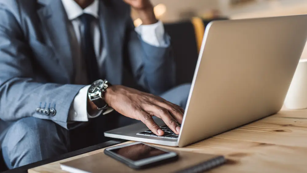 Man typing on laptop