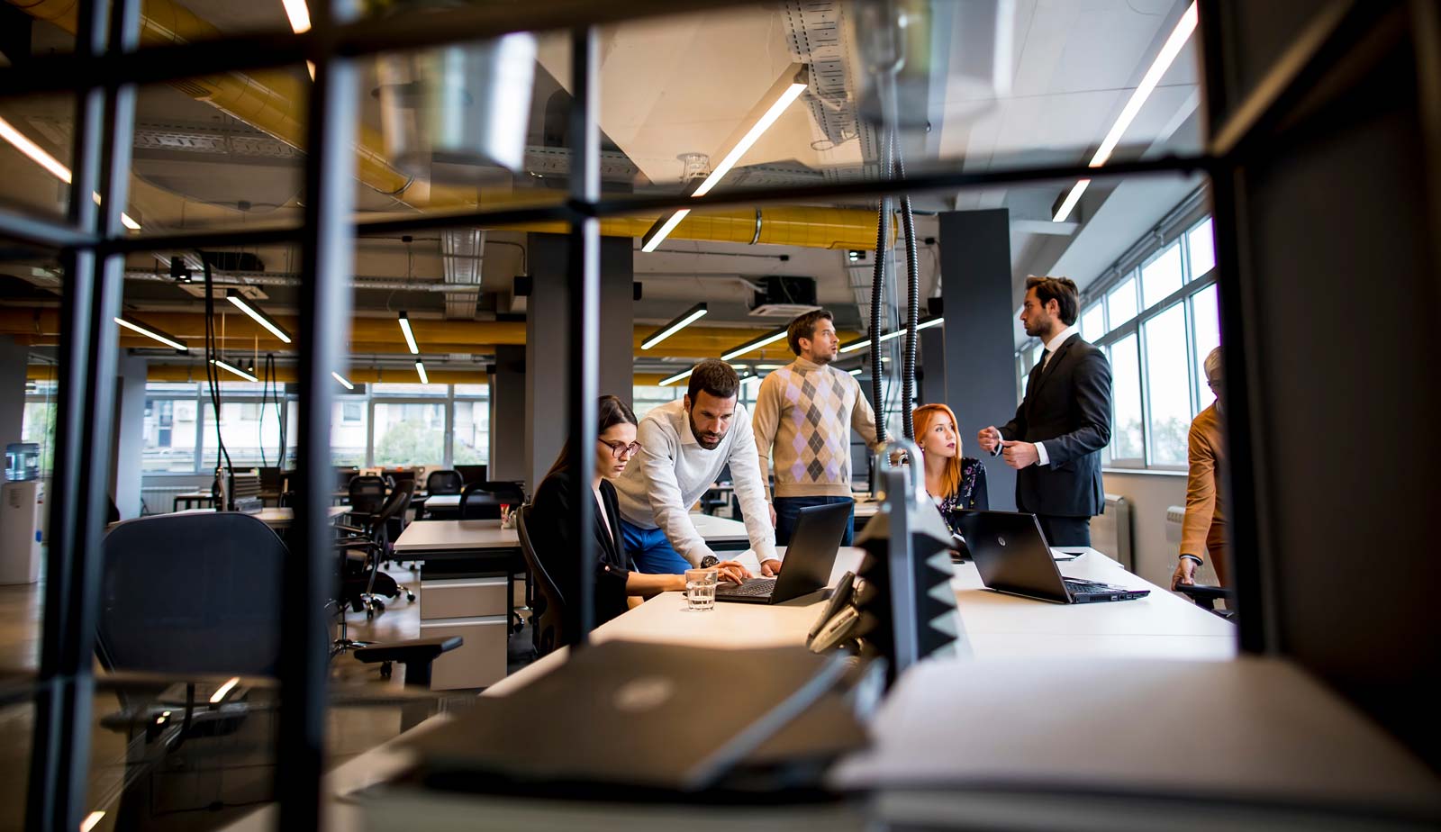 People working around a table in an office
